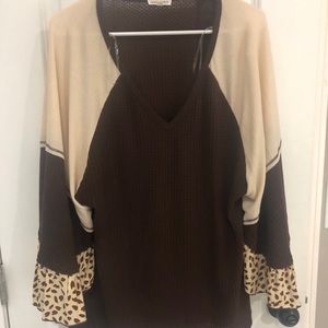 Boutique top with cheetah print attached sleeves